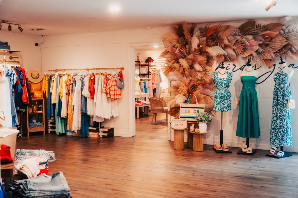 Your Guide to Discovering the Best of Spring Hill, Tennessee A bright clothing boutique featuring colorful summer apparel, mannequins, and decorative dried palm leaves in Williamson County, Tennessee.