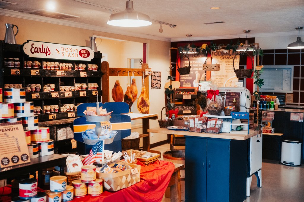 Your Guide to Discovering the Best of Spring Hill, Tennessee A rustic country store interior featuring shelves of honey, hanging hams, and various snacks in Williamson County, Tennessee.