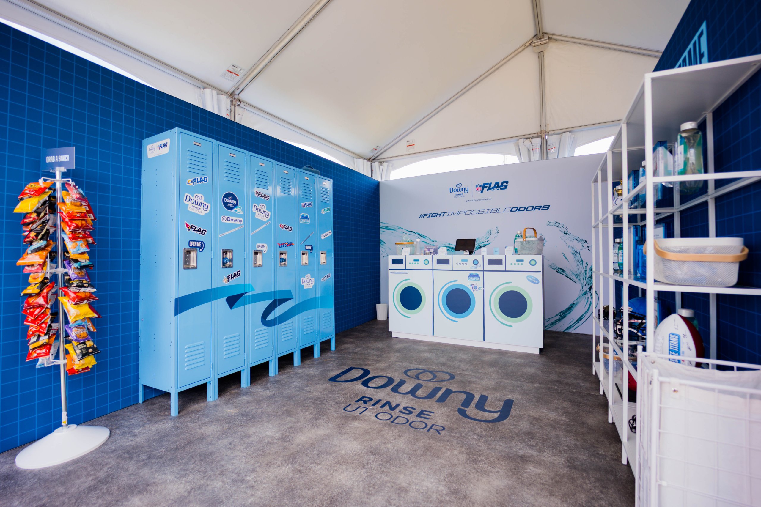 Blue laundry room with lockers, vending machine, and washing machines in Williamson County, Tennessee.