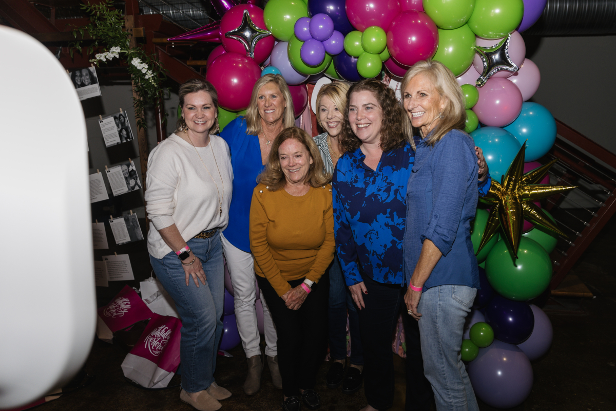 Girls' Night Out with Faithfully Restored A group of six women pose together in front of a colorful balloon arch in Williamson County, Tennessee.