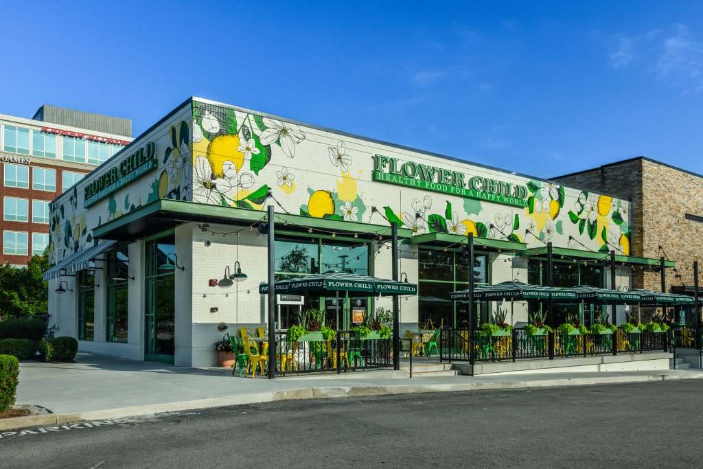 A brightly colored restaurant with a floral mural and outdoor seating in Williamson County, Tennessee.