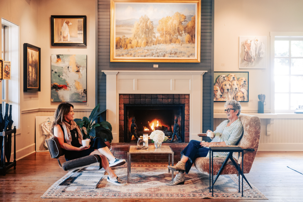 Leiper's Fork, Tennessee: The Revival of a Small-Town Gem Two women enjoy tea by a cozy fireplace in an art-filled living room in Williamson County, Tennessee.