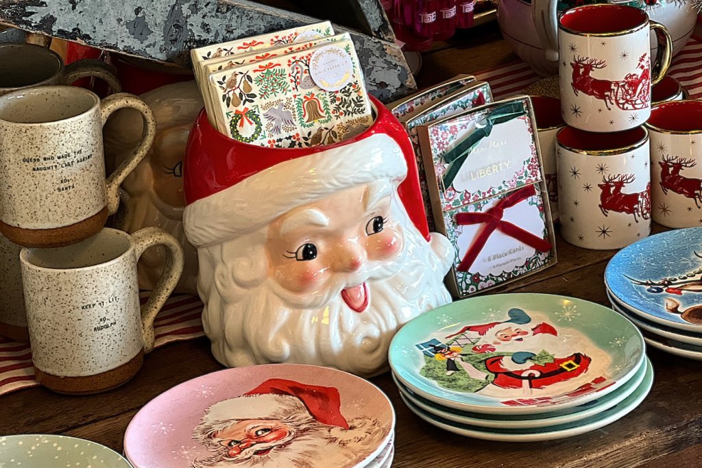 A festive display of Christmas-themed tableware and decorations, including Santa mugs, plates, and a Santa Claus figurine in Williamson County, Tennessee.