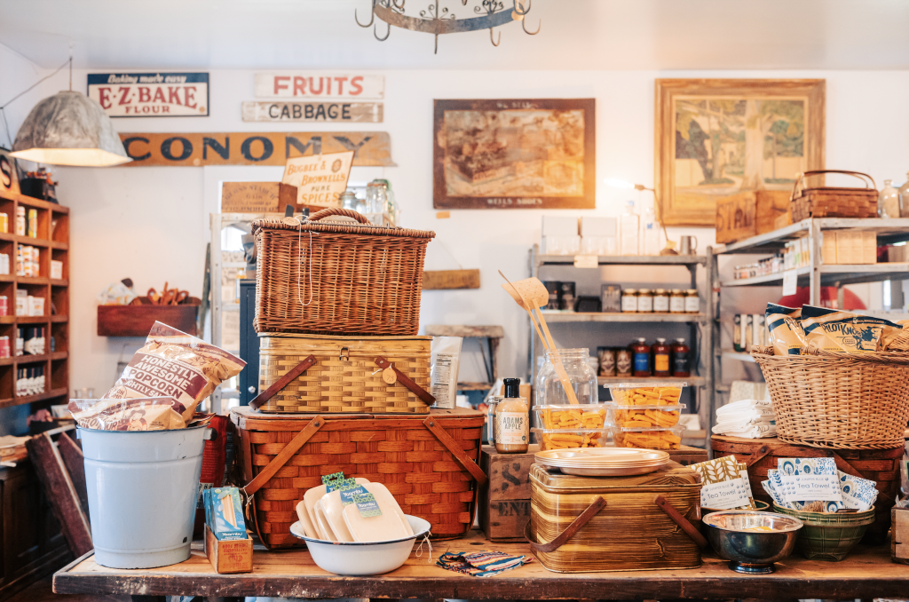 A rustic general store display with vintage baskets, jars, and food items in Williamson County, Tennessee.