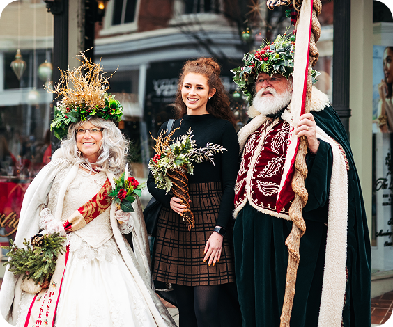 Three costumed individuals in festive attire pose together outdoors in Williamson County, Tennessee.