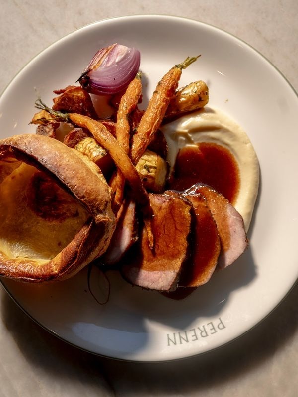 A mouthwatering plate of roast beef with Yorkshire pudding, carrots, mashed potatoes, and gravy in Williamson County, Tennessee.