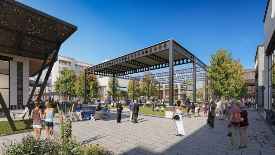What's New & Coming A bustling outdoor shopping center with modern architecture, featuring a large open plaza, covered walkways, and a variety of shops and restaurants surrounded by lush greenery in Williamson County, Tennessee.