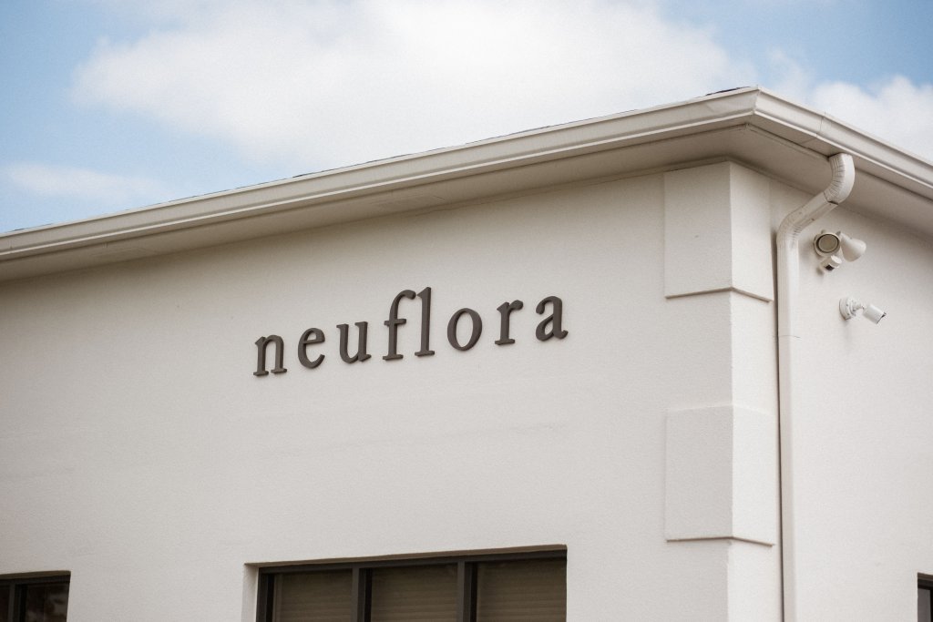 A white building with the word 'neuflora' written on the side in black letters in Williamson County, Tennessee.