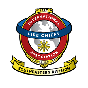 The logo of the International Association of Fire Chiefs Southeastern Division, featuring a globe with a fire chief's helmet and crossed axes in Williamson County, Tennessee.