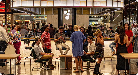 A bustling bar scene with patrons socializing and enjoying drinks in Williamson County, Tennessee.