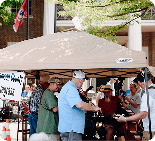 Bluegrass Along the Harpeth A group of musicians perform bluegrass music under a tent at a county fair in Williamson County, Tennessee.