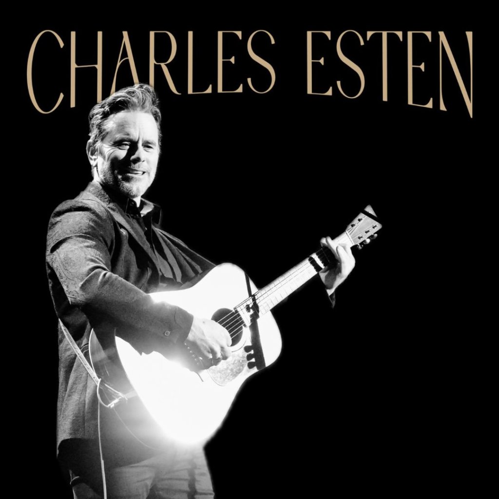 Charles Esten performs on stage with an acoustic guitar in Williamson County, Tennessee.