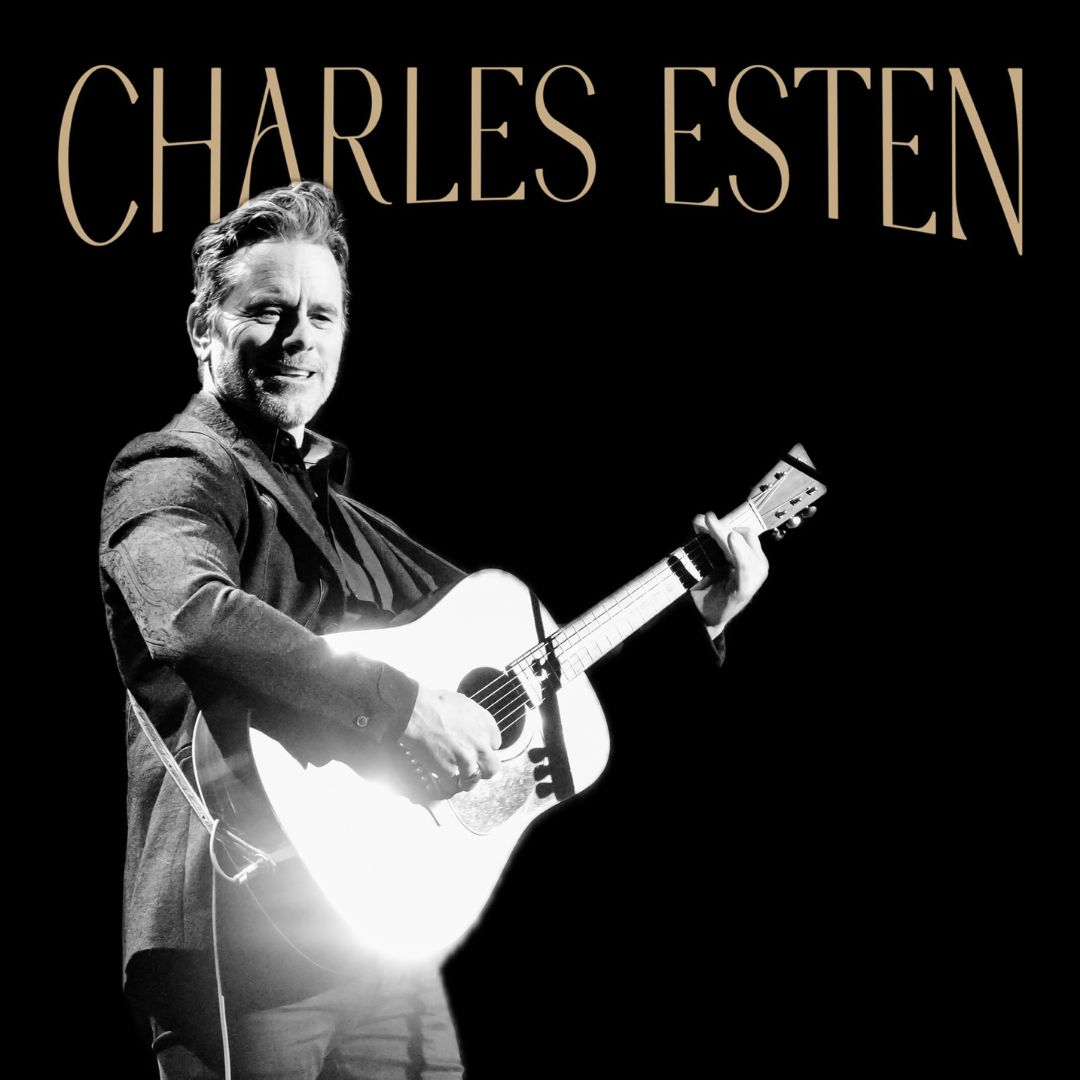 Charles Esten performs on stage with an acoustic guitar in Williamson County, Tennessee.