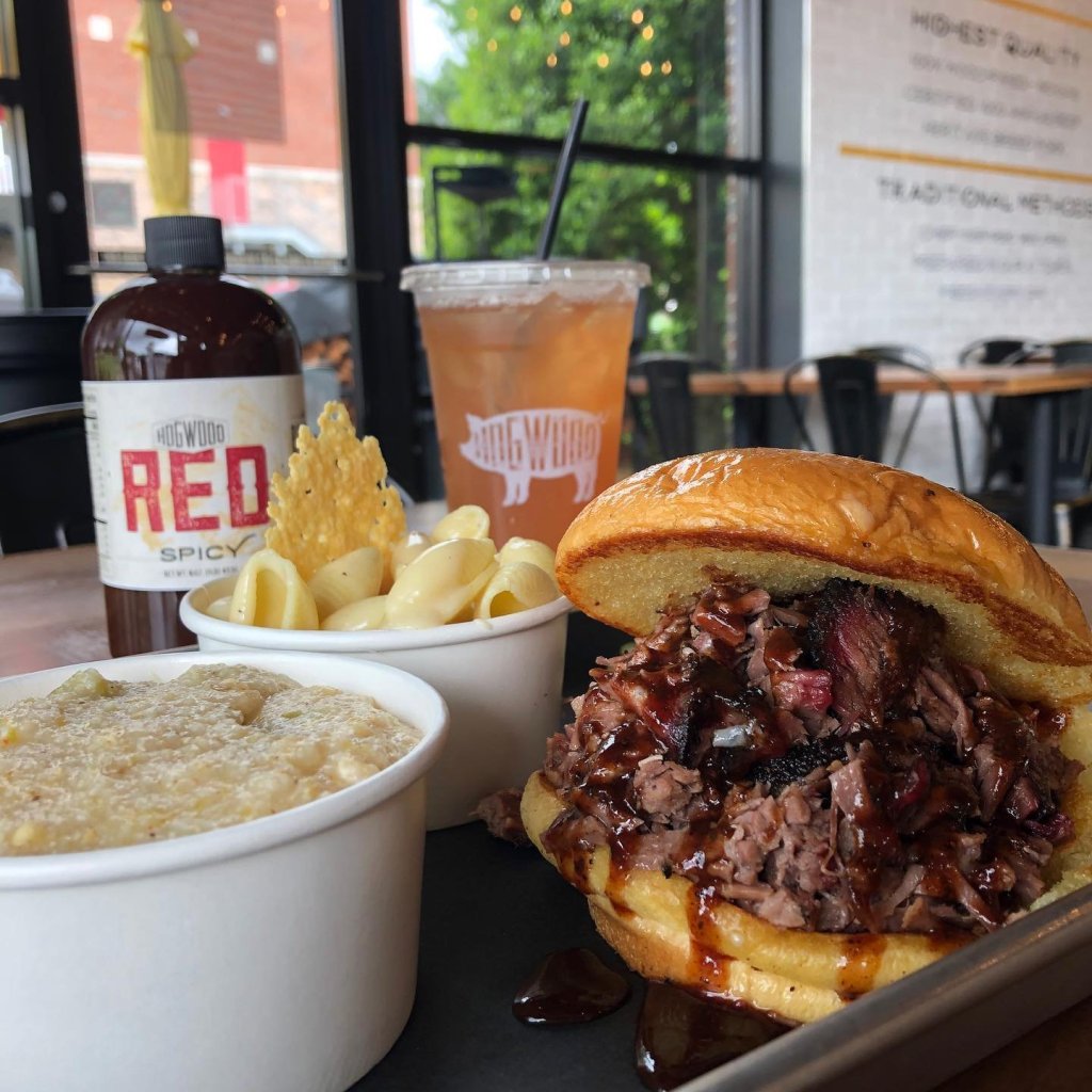 A mouthwatering pulled pork sandwich with a side of creamy macaroni and cheese, cornbread, and a refreshing glass of iced tea in Williamson County, Tennessee.