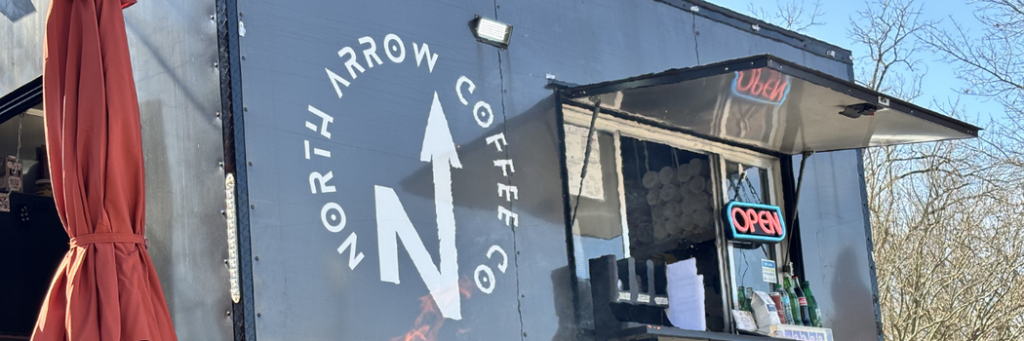 North Arrow Coffee Company A black coffee truck with a red awning, featuring the logo 'North Arrow Coffee Co.' and an 'Open' sign in Williamson County, Tennessee.