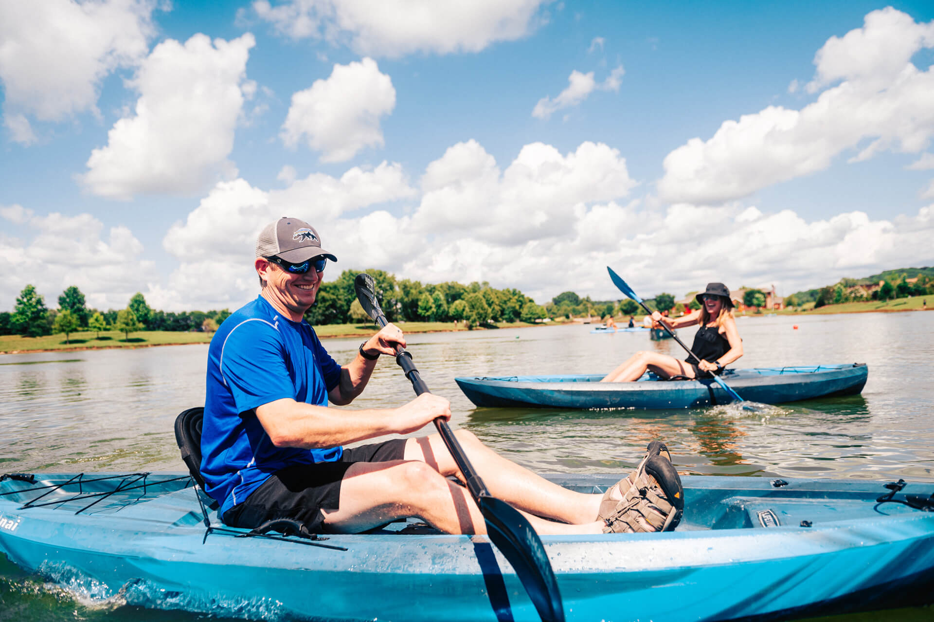 Top 10 Things to Do in Franklin A man and a woman kayaking on a sunny lake under a blue sky in Williamson County, Tennessee.