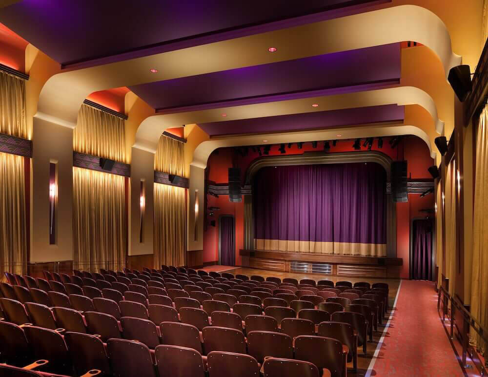 Top 10 Things to Do in Franklin An empty theater with rows of seats facing a stage with purple curtains in Williamson County, Tennessee.