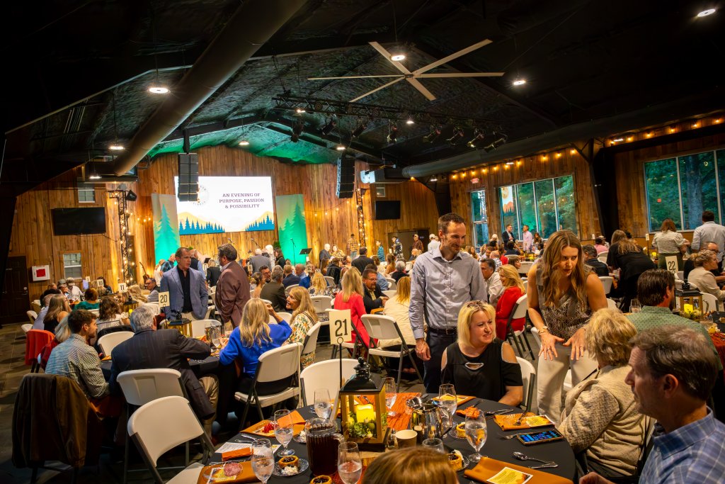 Deer Run's Vision Dinner People gathered at tables in a rustic event hall for a formal evening event in Williamson County, Tennessee.