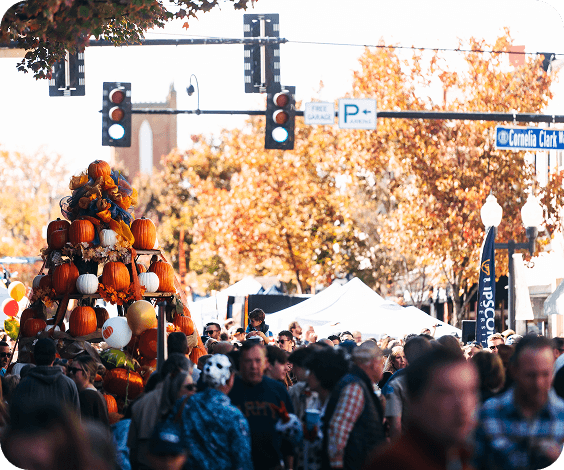 PumpkinFest A crowded street festival featuring a large pumpkin display under autumn trees in Williamson County, Tennessee.