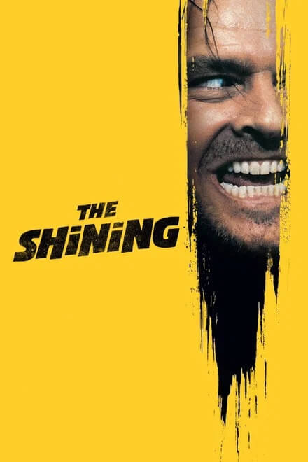 A movie poster for The Shining featuring a man's face on a yellow background in Williamson County, Tennessee.