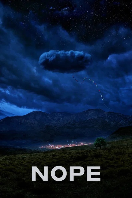 A mysterious dark cloud hangs over a desert landscape with a string of flags in Williamson County, Tennessee.