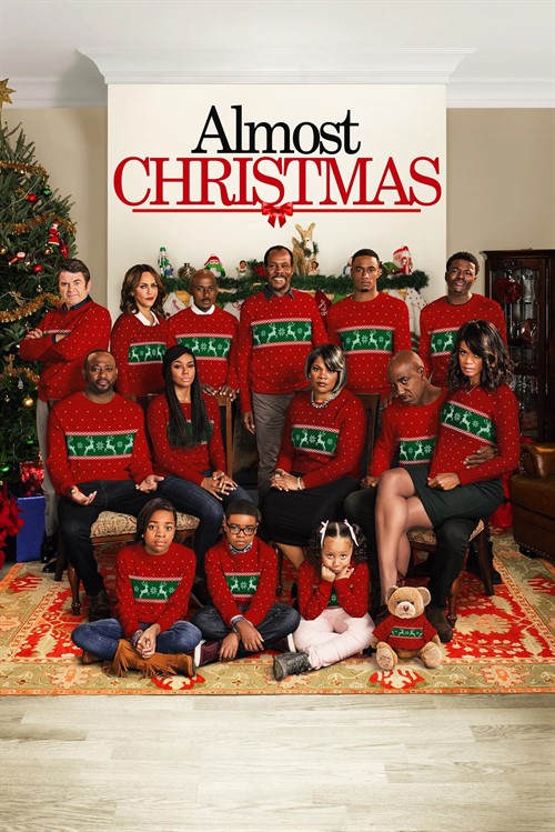 A large family wearing matching red Christmas sweaters poses for a group portrait in Williamson County, Tennessee.