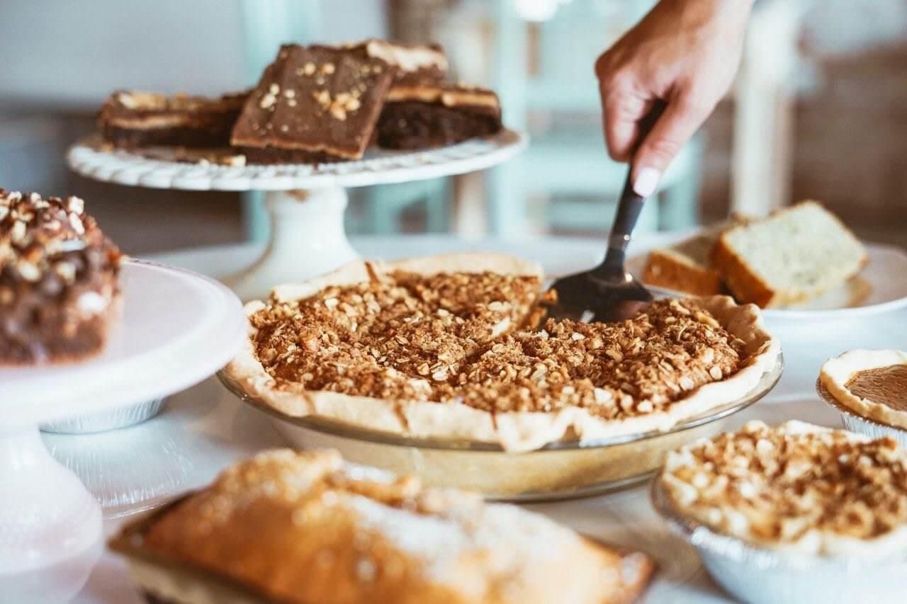 A hand uses a server to lift a slice of crumble pie in Williamson County, Tennessee.