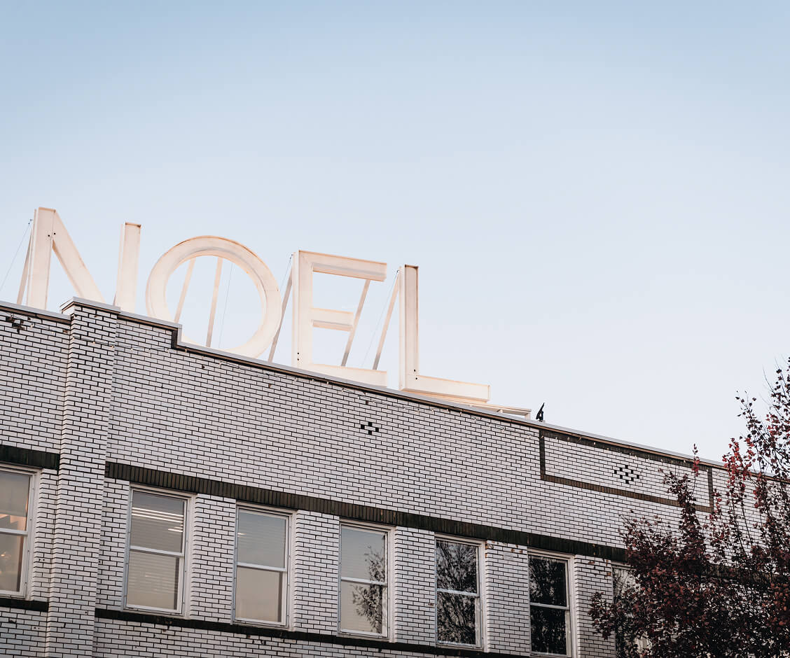 A Hallmark Christmas Escape A white brick building with a large NOEL sign on the roof in Williamson County, Tennessee.