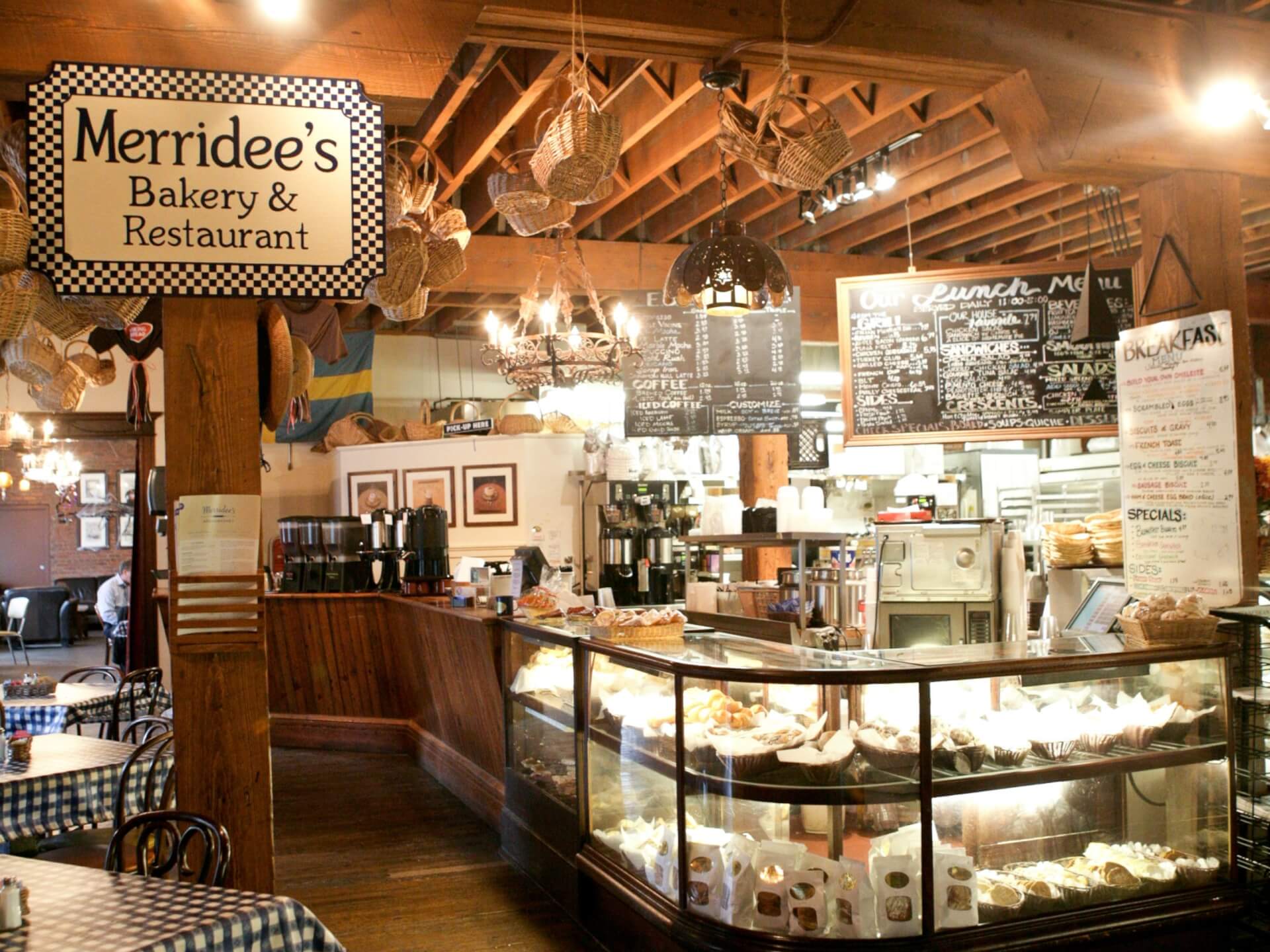 A Family Recipe, a Famous Bakery, and a Franklin Story: The Makings of Merridee's Breadbasket The interior of a rustic bakery and restaurant with a glass display case of pastries in Williamson County, Tennessee.