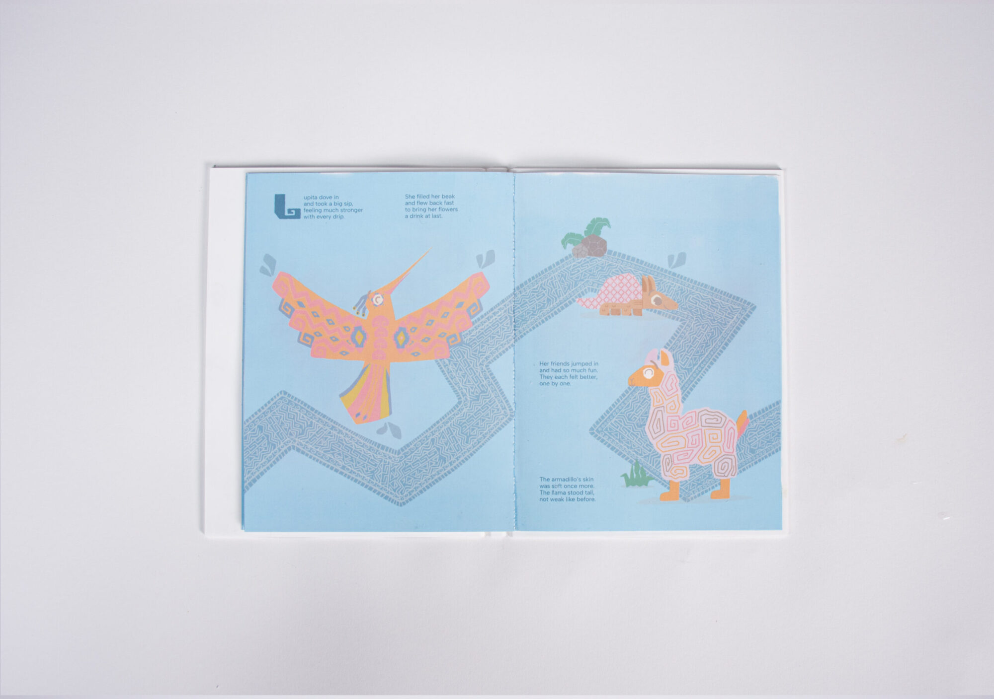 Pages of "The Thirsty Hummingbird" book that are hydrated and the content is visible.