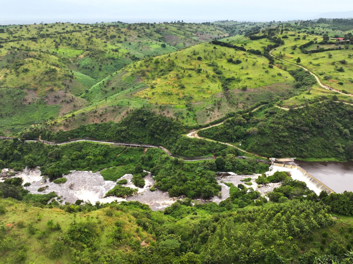 Rolling green hills with the  winding Mpanga river and scattered vegetation