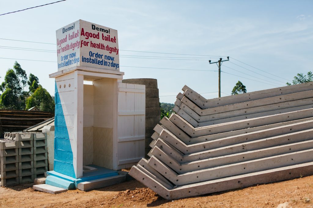 A business promotes their toilet construction by showing a new latrine