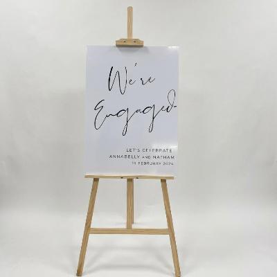Easel and White Acrylic Sign