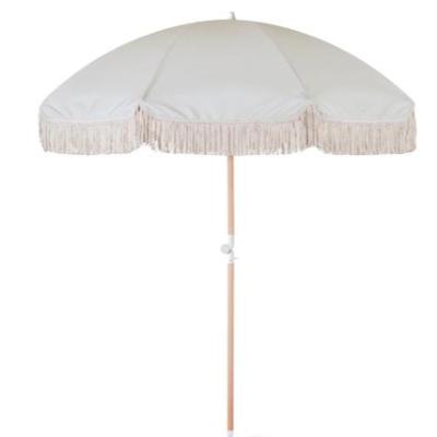 Antique white fringe beach umbrella
