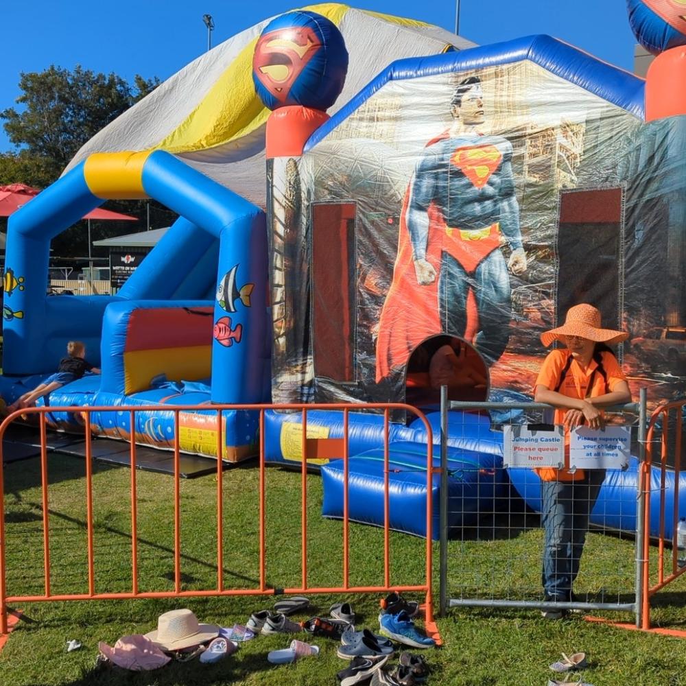 Professionally Supervised and fenced jumping castle and slide combo for events